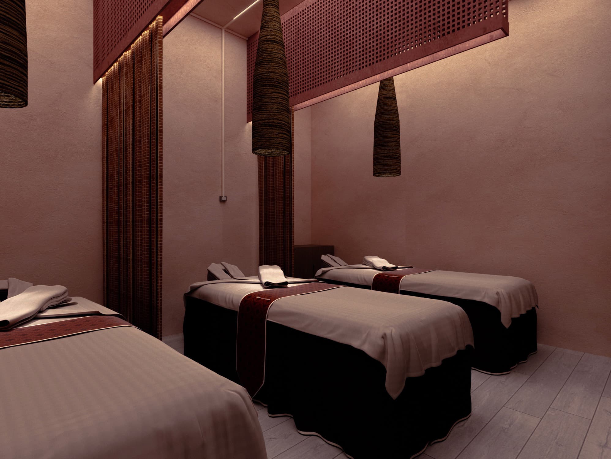Facial room with three draped treatment beds and woven pendant lights